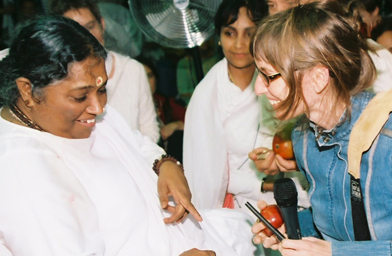 
                    Amma gives treats with her hugs.
                                            (Janani Noia, M. A. Center (Copyright 2006))
                                        