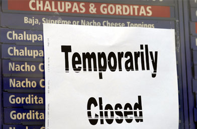 A temporarily closed sign hangs at a Taco Bell restaurant December 7, 2006 in Philadelphia, Pa. Taco Bell restaurants in the Philadelphia area have closed voluntarily for testing after five people who dined there contracted an E. coli illness.
(William Thomas Cain / Getty Images)