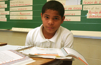 
                    Darwin Rios, who just arrived from Honduras, sits in his math class at Webb Middle School in Austin, Texas.
                                            (Michael May)
                                        