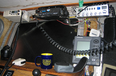 
                    Ernie keeps in touch with the herring fishermen on other boats in the bay.  Some of them share tips on where the fish are spawning.
                                            (Krissy Clark)
                                        