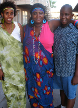 
                    Jeanne, Claudine and Jeanne's son Ralph stand outside an apartment complex in Phoenix where many of the Burundian refugees are being re-settled.
                                            (Ann Heppermann and Kara Oehler)
                                        