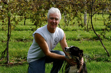 
                    Barney Lavin, a cattle farmer who opposes the construction of an ethanol plant near his home, with the family dog.
                                            (James Mills)
                                        