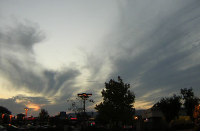 
                    Vogel took this photo Friday night on his way home from work, looking west towards the city of Poway. There is still a lot of smoke in the atmosphere, but it's becoming thinner and  wispy in some places.
                                            (John Vogel)
                                        