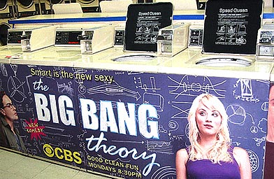 Ads for the TV series Big Bang Theory greet a captive audience at a laundromat.
(David Kessler/Laundromedia.com)