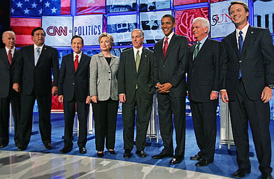 From left to right, U.S. Sen. Joe Biden, New Mexico Gov. Bill Richardson, U.S. Rep. Dennis Kucinich, U.S. Sen. Hillary Clinton, Democratic National Committee Chairman Howard Dean, U.S. Sen. Barack Obama, U.S. Sen. Chris Dodd, and former U.S. Sen. John Edwards, are introduced during a Democratic presidential debate in Las Vegas.
(Ethan Miller / Getty Images)