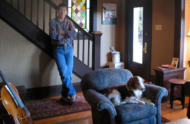 
                    Parker and Ron Jelaco in the living room, the most complete room in the house. Note the spool of wire and the boxes of Ann Sacks tile, which have been in that corner behind the door for a least a year.
                                            (Ron Jelaco)
                                        