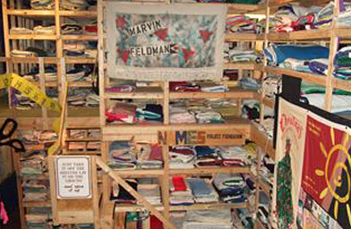 
                    Quilt panels stacked up and displayed in the Atlanta, GA NAMES Project Foundation offices.
                                            (The NAMES Project Foundation, Atlanta, GA)
                                        