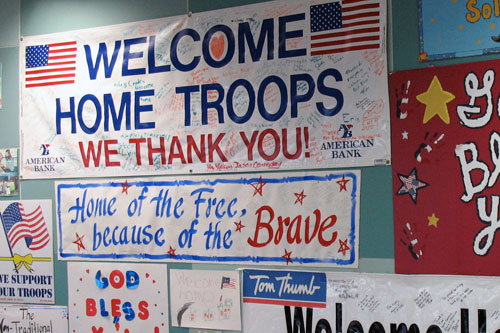 
                    Posters and banners line the walls at the old international arrivals gate, Terminal B at Dallas Fort Worth Airport.
                                            (Julia Barton)
                                        