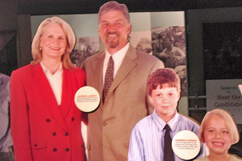 
                    When you enter the Caucus Exhibit you first meet the candidate and her family and 50 individuals it takes to run a campaign.  Cindy Peterson, the State Historical Society's director, and her husband played the candidate.
                                            (Kyle Gassiott)
                                        