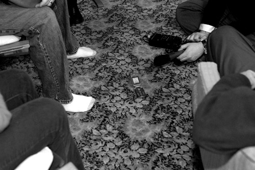 People in the Willis's Rockwell city living room listen to Senator Barack Obama on Katie Malkin's cell phone. Malkin is a field ogranizer for Obama's campaign. Senator Obama gave this cell phone speech during pre-caucus events held across the state December 13, 2007.
(Sarah Mercier)