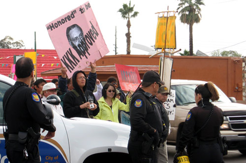 
                    Phoenix police kept the two groups on either side of 35th Street.
                                            (Karin Davies)
                                        