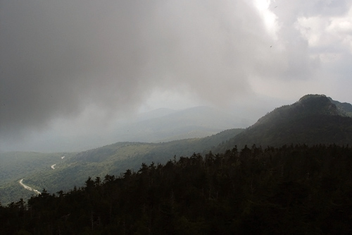
                    View of North Carolina's Blue Ridge Parkway from atop Grandfather Mountain. Weekend America listener Ewa Powell often feels as if she can almost touch the fog that rolls by the distant Smoky Mountains.
                                            (Ewa Powell)
                                        