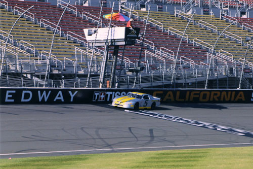 
                    Charlie crosses the finish line.
                                            (Drivetech Racing School)
                                        