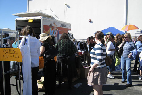
                    Many people showed up to view the wares at the yard sale.
                                            (Paula Kaatz)
                                        
