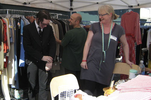 
                    One bargain hunter tries on a used tux.
                                            (Paula Kaatz)
                                        