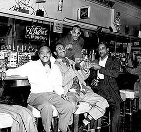 Men hanging out at the Texas Playhouse.
(Red Powell/Reggie Pettus Collection, KQED, and authors Elizabeth Pepin and Lewis Watts)