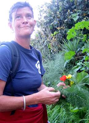 
                    Nance Klehm with a handful of salad greens, including fennel, mallow and wood sorrel.
                                            (Suzie Lechtenberg)
                                        