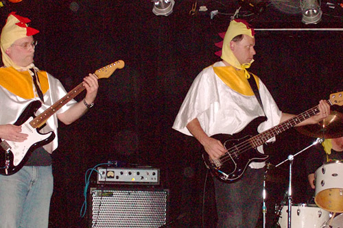 Joe and Tom Chicken performing in Chicken Starship's last performance together. The band has chosen to use the surname "Chicken" in performance -- partially in tribute to the Ramones, and partially to protect their reputations.
(Jill Moe)
