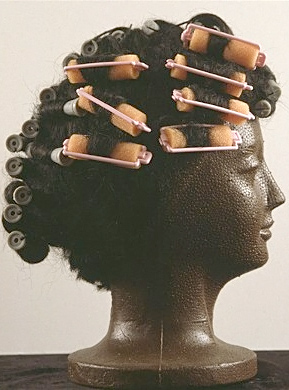 
                    After Ebony magazine ran a feature in 1973 on Ellis' "Superfly" hairstyle, Ellis became the darling of U.S. hairdressers.   When Ellis walked onto the field in hair curlers during pre-game workouts, Commissioner Bowie Kuhn sent a letter to the pitcher ordering him to cease and desist wearing curlers onto the field. After declaring, "They didn't put any orders about [Yankees star] Joe Pepitone when he wore a hairpiece down to his shoulders," Ellis reluctantly shelved the curlers.  Following his 1999 Shrine of the Eternals induction, Dock Ellis donated to the Baseball Reliquary all his hair curlers and permanent rods.
                                            (Courtesy Larry Goren /The Baseball Reliquary)
                                        