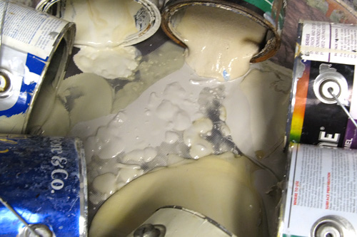 
                    Donated paint being mixed together for reuse.
                                            (Nancy Mullane)
                                        