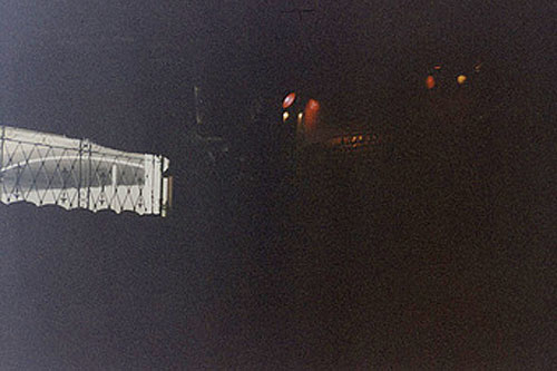 There are lights, there is a window, there is something outside the window that could be either a freeway overpass or a surfboard. I made two copies of this picture so it must have been important. And then I saved it for years.
(John Moe)