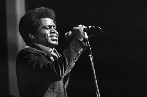 James Brown performs at the Olympia Hall in Paris, 1971. Brown is credited for calming racial tensions with a live performance in Boston three years earlier in the aftermath of the Rev. Martin Luther King Jr.'s assassination.
(AFP/Getty Images)