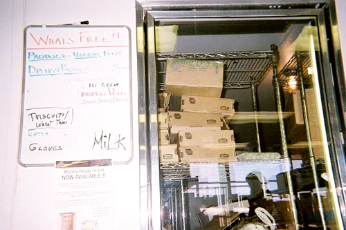 
                    A white board lists the day's free items at the food bank.
                                            (Kaiah Callahan)
                                        