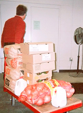 
                    A customer leaves with supplies for their food pantry.
                                            (Kaiah Callahan)
                                        