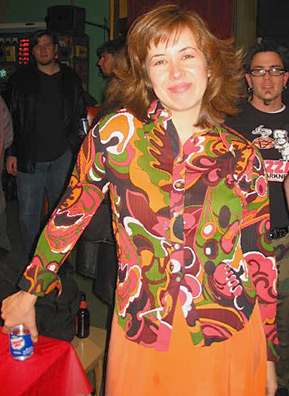 
                    Linda Williamson at the Grilled Cheese Invitational. Her outfit? "Velveeta-orange skirt, topped with a blouse featuring the colors of broiled squash and grilled cheese."
                                            (Kevin Rolly)
                                        