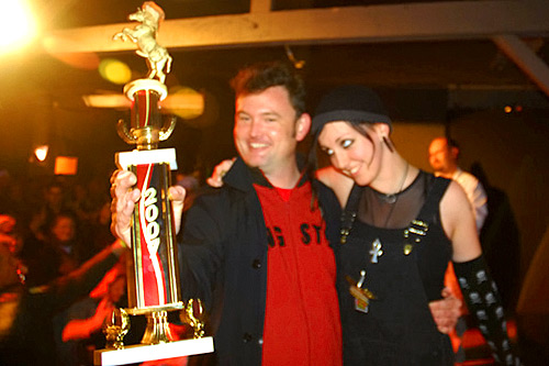 Patrick Grover shows off his first-place Grilled Cheese Invitational trophy. His creation, "The Mussolini," won the Kama Sutra category.
(Kevin Rolly)