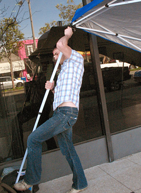 
                    Simmons sets up the Free Conversation Booth tent.
                                            (Ekene Okobi)
                                        