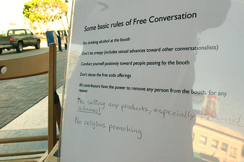 The Conversation Booth Rules include directives such as: "Don't be creepy" and "Conduct yourself positively towards other people passing the booth." The newest rules are written in pen at the bottom.
(Ekene Okobi)