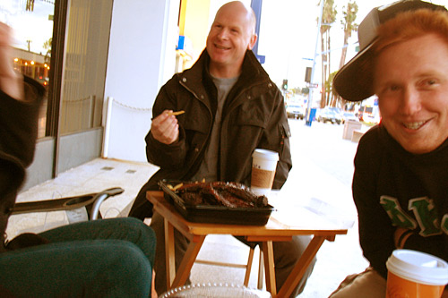 
                    Tim (left) and Brett are two of the Free Conversation Booth's frequent "contributors" -- a term Simmons uses to describe regular visitors to his booth.
                                            (Ekene Okobi)
                                        