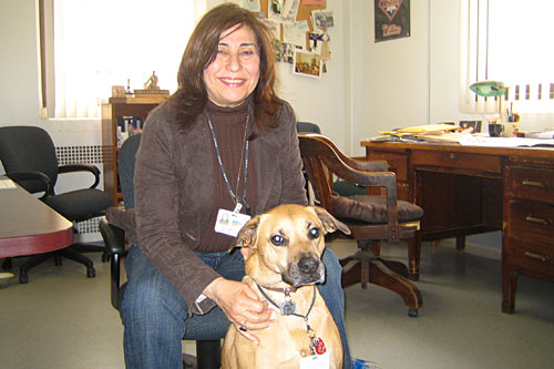 Leslie Martin and Cassie the "therapy dog," who likes to sleep at the feet of the vets as they're talking, and nuzzle them now and then.
(Krissy Clark)