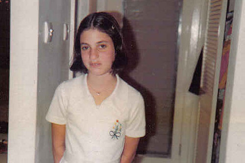 
                    Susan Davis at about 8-years-old, 1976 -- "old nose and buck teeth." At age 12: "I managed to gather a bunch of photographs of myself. I stabbed myself through the face in every one of those photographs with scissors or a knife -- I don't remember exactly -- stabbing and stabbing and stabbing."
                                            (Courtesy Susan Davis)
                                        