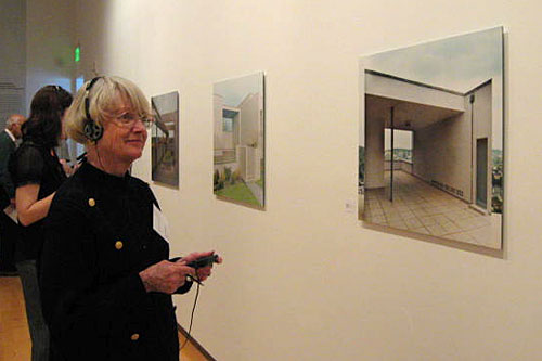 A museum patron listens to other patrons critique a work of art using the "Round" device.
(Courtesy Halsey Burgund)