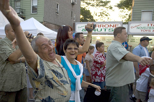 
                    Celebrants enjoying the Feast of San Paolino in Williamsburg, Brooklyn.
                                            (Michael Bocchieri)
                                        