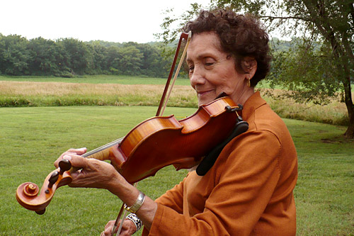 
                    Teresa Cuevas in the backyard of her house in a rural neighborhood North of Topeka.
                                            (Sylvia Maria Gross)
                                        