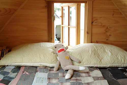 
                    Dee's loft bed. She says a side-effect of living in a tiny house is that she talks to her stuffed animals.
                                            (Joshua McNichols)
                                        