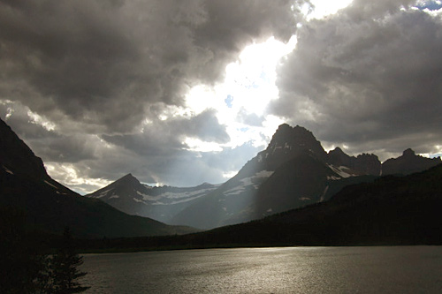 
                    Sun streams through the clouds over Many Glacier Valley.
                                            (Michael May)
                                        