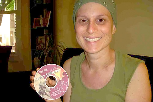 After being diagnosed with stage two breast cancer, numerous rounds of chemotherapy and an intense medication regimen, Audrey Stillerman was restless, anxious and unable to sleep. Dr. Moore prescribed BMT for Stillerman, who is pictured here holding her personalized CD.
(Jim Gates)