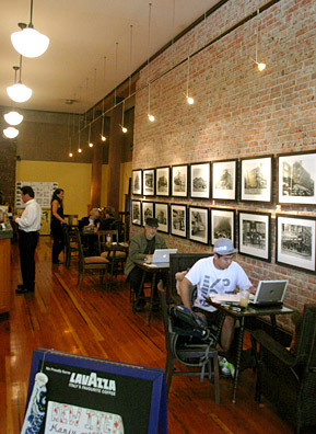 
                    Patrons enjoy tea inside the teahouse, while Johnson answers questions about the building in the back.
                                            (David Weinberg)
                                        