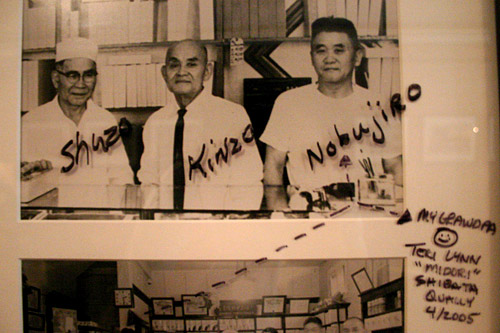 
                    An example of a photograph hanging on the wall of the teahouse on which someone has left a note for Johnson about some of the people who worked in the shops in Japantown.
                                            (David Weinberg)
                                        
