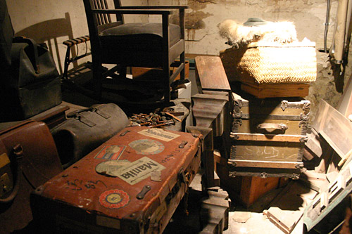 Some of the items left behind by Japanese residents bound for the internment camps. In the foreground, with all its travel stickers is Johnson's favorite "little brown suitcase."
(David Weinberg)