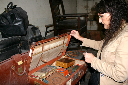 
                    Johnson explains that the suitcase holds "cigar boxes full of little treasures."
                                            (David Weinberg)
                                        