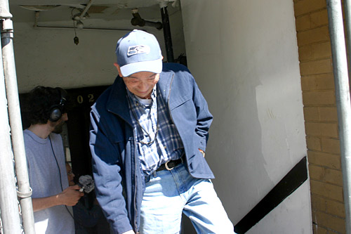 
                    Eddie exits the bathhouse onto Main Street after our tour.
                                            (David Weinberg)
                                        