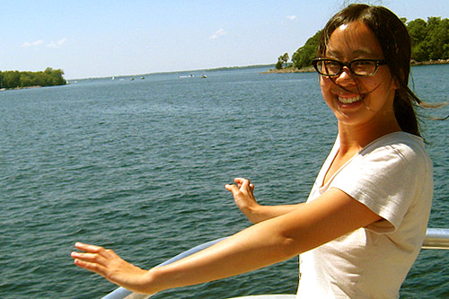 
                    We smile stupidly at what a great idea our camping is on the ferry ride into Burton Island.
                                            (David Maxon)
                                        
