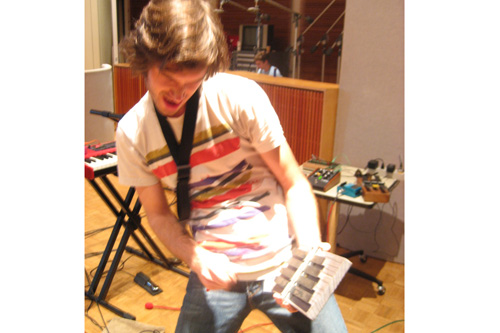 
                    Elliot Bergman introduces us to one of his handmade amplified kalimbas--arena rock style.
                                            (Angela Kim)
                                        