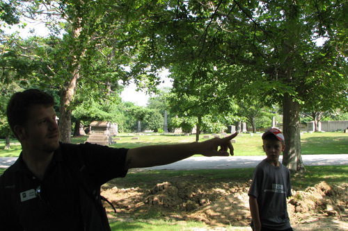 
                    Justin Graves, a naturalist on loan from the Nature Center at Shaker Lakes, points out things of interest on the walk.
                                            (Mhari Saito)
                                        