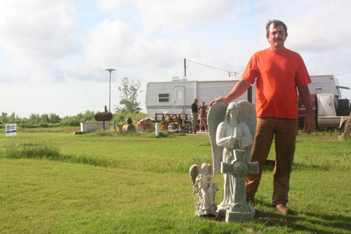 
                    David Connor in front of FEMA trailer.
                                            (Daniel May)
                                        